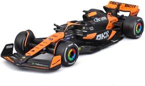 Rotaļu sacīkšu automašīna Bburago McLaren F1 Team MCL38, 18-38214, 1:43, melna krās./oranža krās.