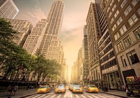Fototapetas Artgeist In The Shadow Of Skyscrapers - New York With Pedestrians And Taxi Cars NEW010596, 245 cm x 245 cm